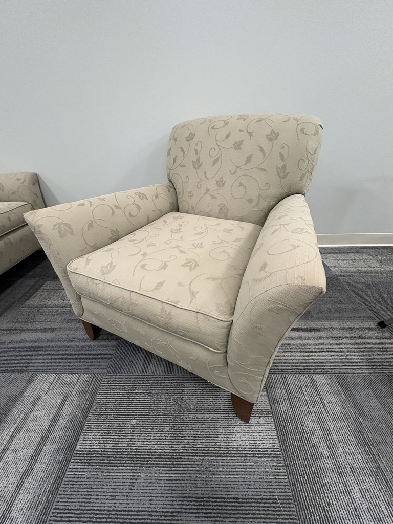 Cream fabric arm chair with flower pattern and mahogany feet 