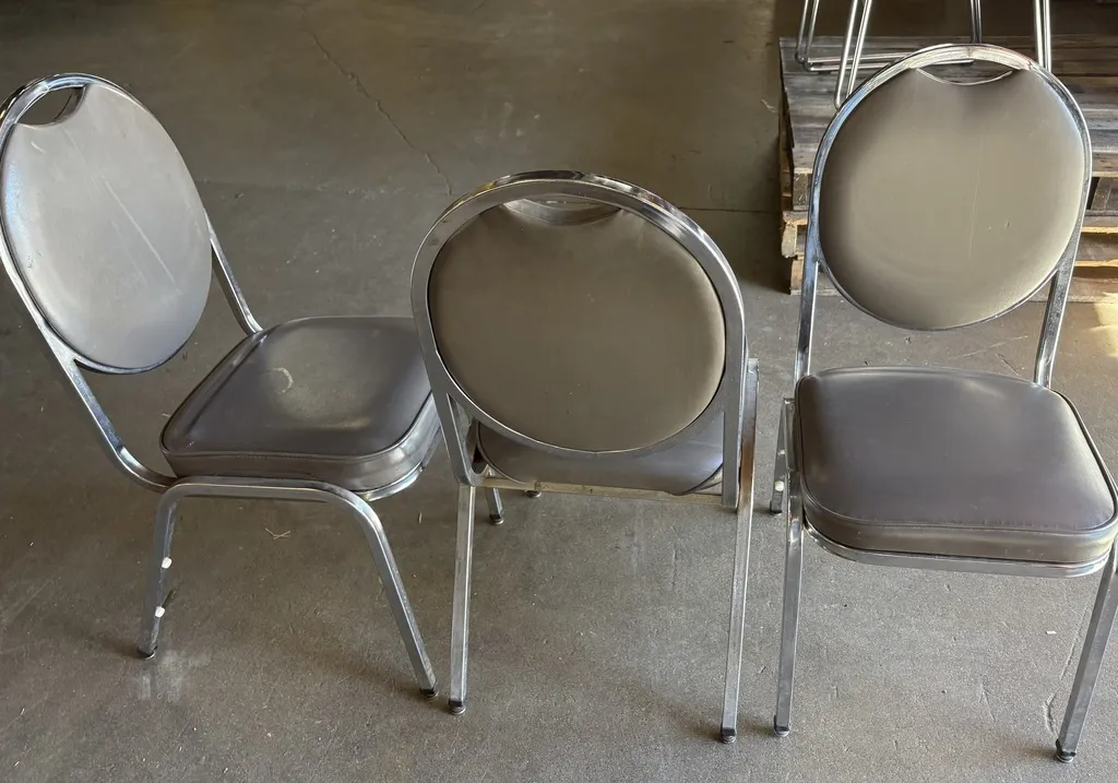 Stackable Banquet style chair, Charcoal vinyl, chrome frame (pre owned)