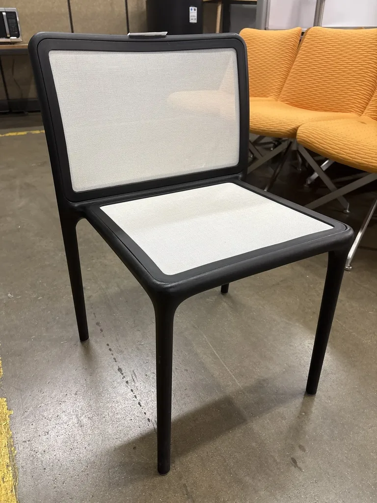 Segis multipurpose side chair, stackable, black frame, armless, beige mesh seat & back
