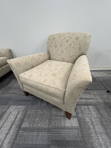 Cream fabric arm chair with flower pattern and mahogany feet 