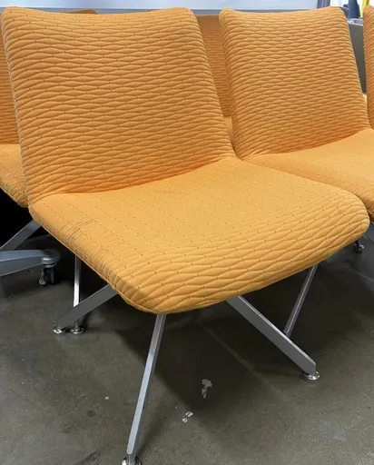 HBF Guest chair, orange fabric, armless, swivel, polished Aluminum base
